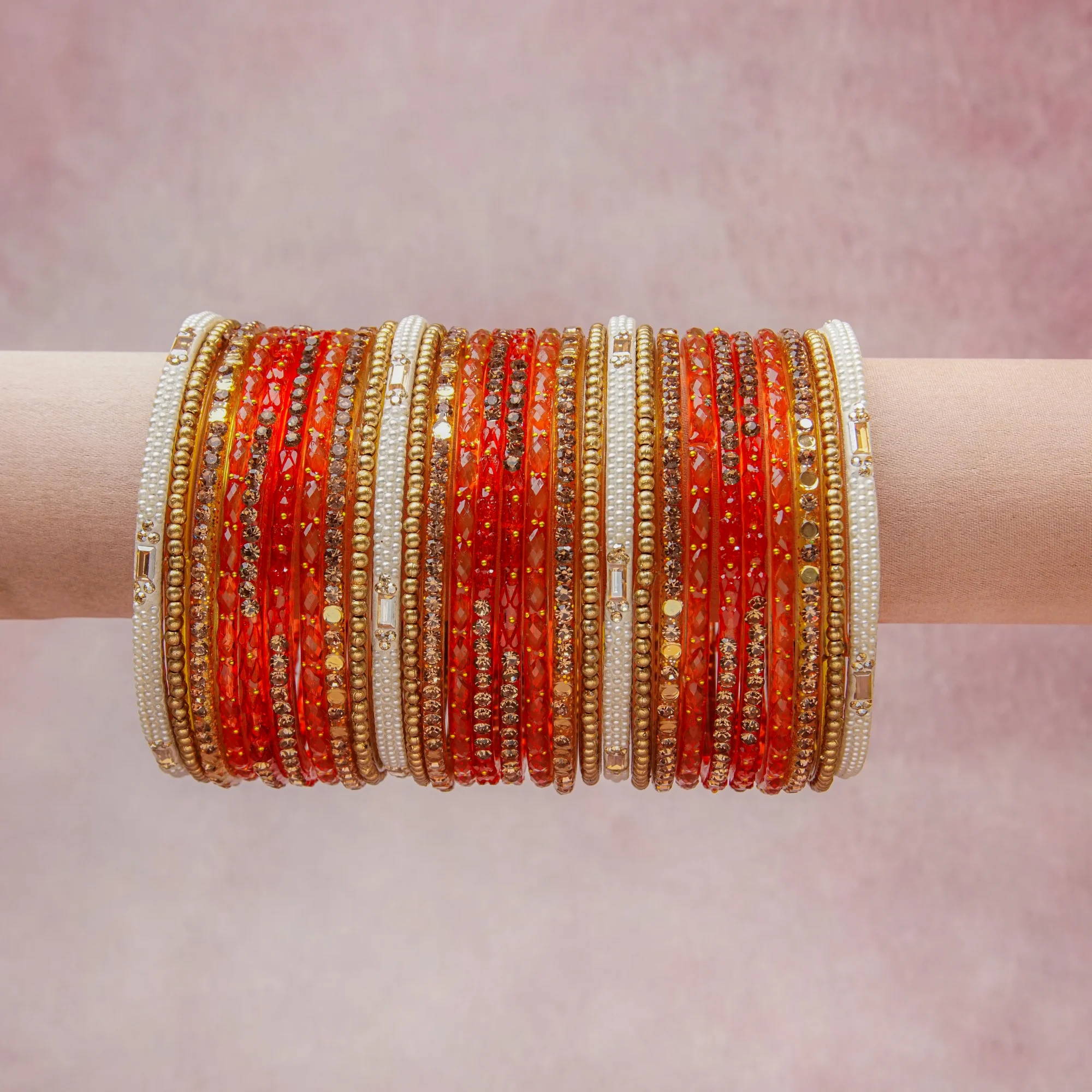 A grounding Vermillion Red forms the heart of the set, while touches of Antique Gold, Pearl White, Clear Crystal add charm.

A thoughtful composition of Glass, Gold-toned Metal, Faux Pearls, Crystals, designed to feel complete without being heavy.
Each element layers seamlessly, creating a look that is refined, wearable and quietly striking.